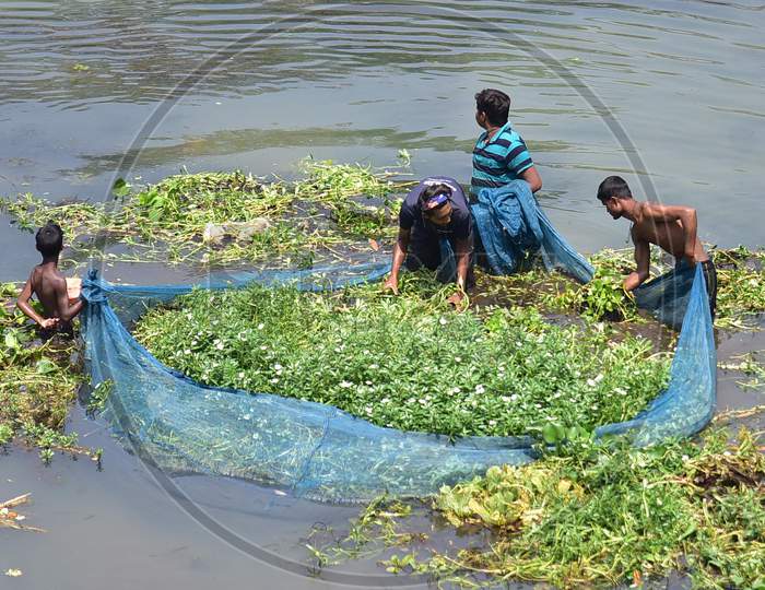 People Fising On Kolong River During Nationwide Lockdown, As A Preventive Measure Against The Covid-19 Coronavirus, In Nagaon District Of Assam On April 03,2020
