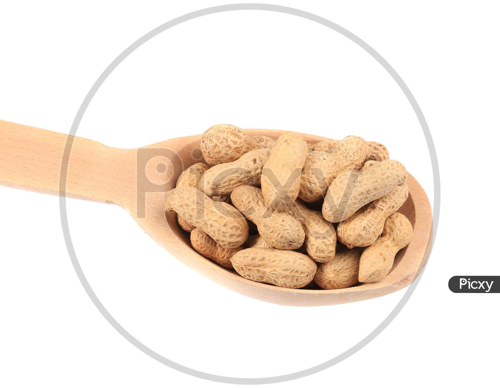 Close Up Of Wooden Spoon With Peanuts. Isolated On A White Background.