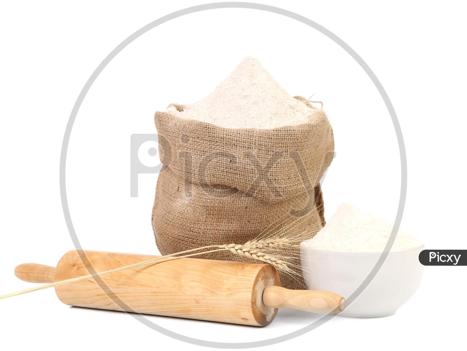 White Flour And Rolling Pin. Isolated On A White Background.