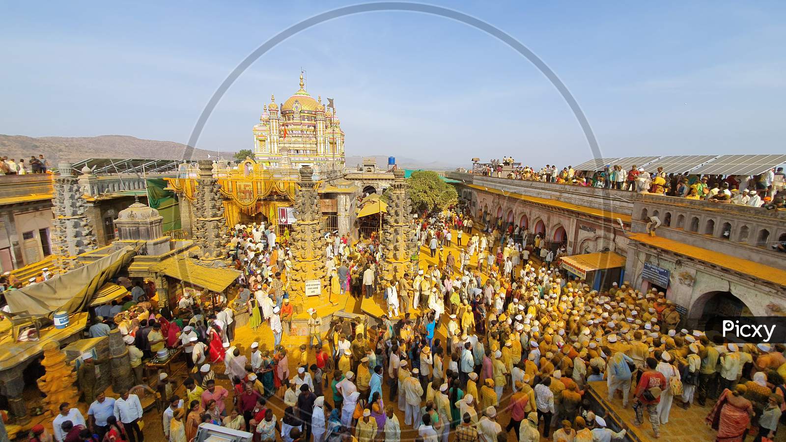 People Throwing Turmeric At Jejuri Temple - Yellow Festival.