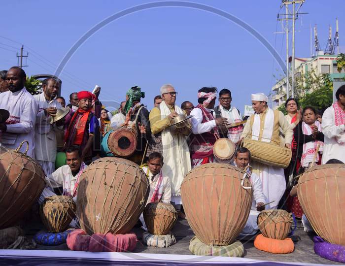 Artists play traditional musical instruments during a protest against the Citizenship Amendment Act 2019, in Guwahati