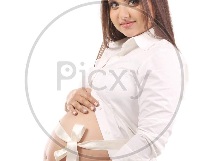 Beautiful Pregnant Woman. Isolated On A White Background.