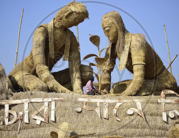 A worker prepares a makeshift cottage called Bhelaghar, which is made of bamboo and straw, as part of celebrations ahead of the Magh Bihu festival in Morigaon