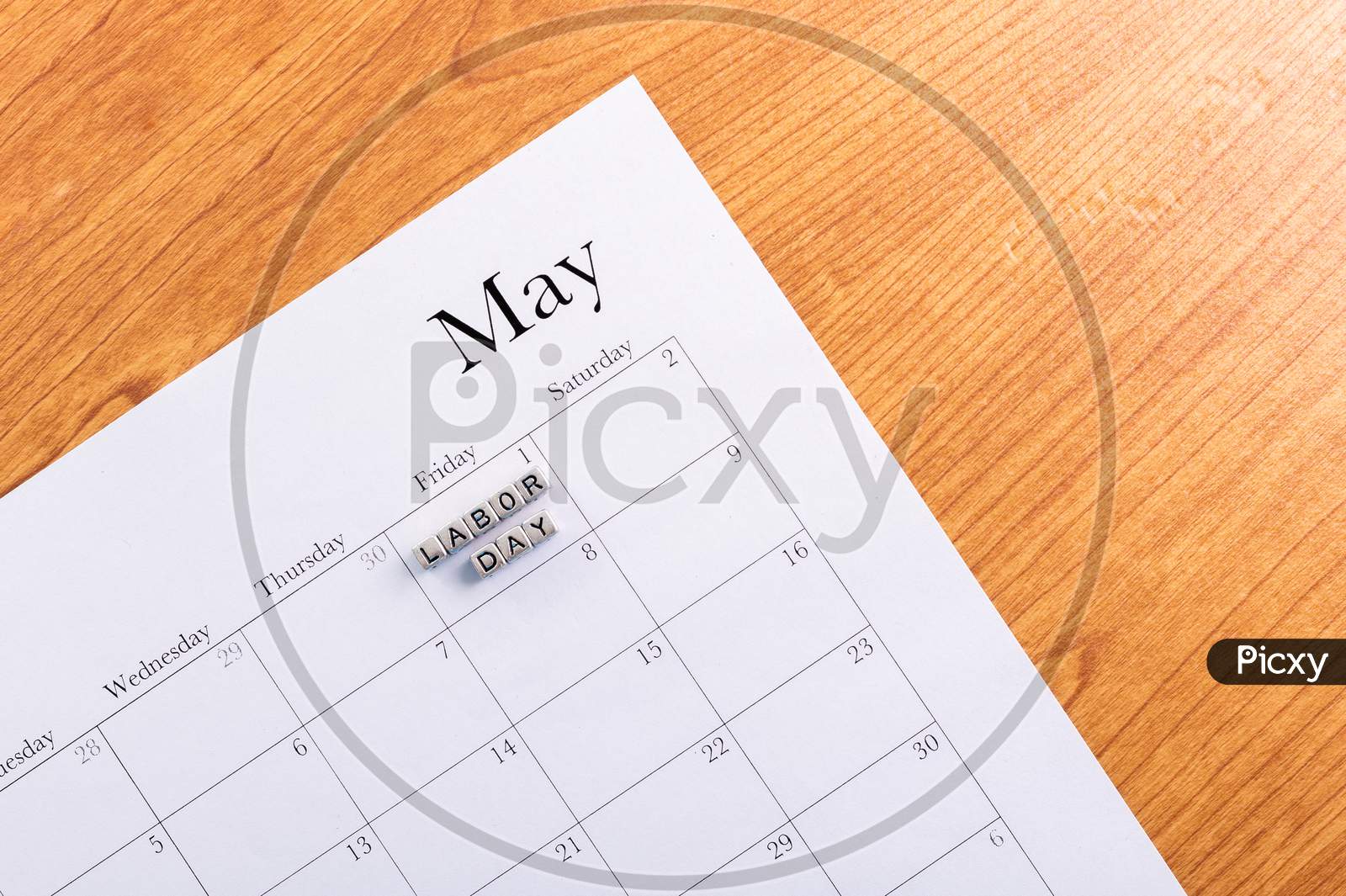 Concept Image Of A Calendar With A Silver Cube Word. Closeup Shot. The Words "Labor Day" On Isolated, Copy Space