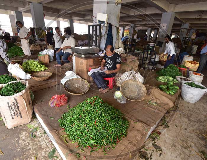 Vendors  Wait For Customer At A  Vegetables Market  On The Third  Day Of National Lockdown Imposed By Pm Narendra Modi To Curb The Spread Of Coronavirus In Nagaon District Of Assam,India
