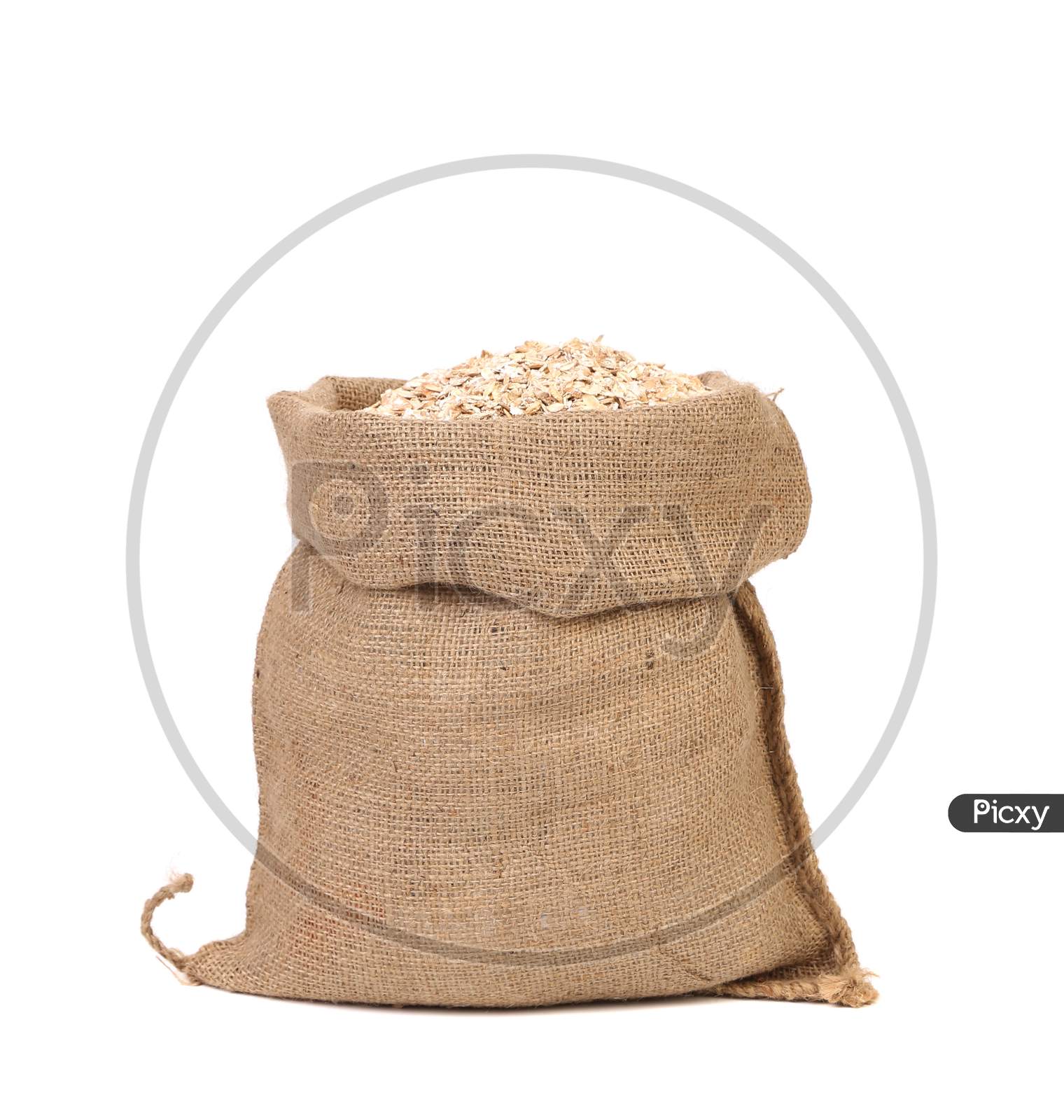Bag Of Oatmeal Flakes. Close Up. Isolated On A White Background.