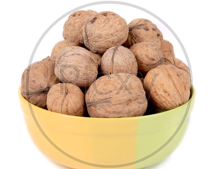 Bowl Full With Walnuts. Isolated On A White Background.