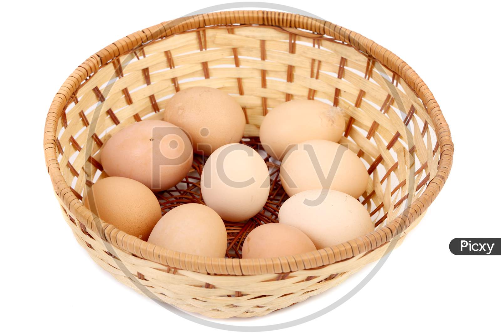 Eggs In Basket. Isolated On A White Background.