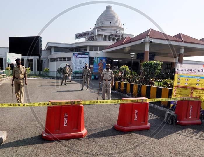 Security Person Stand Guard Outside The Kamakhya Railway Station  During A Government-Imposed Nationwide Lockdown As A Preventive Measure Against The Covid-19 Coronavirus In Guwahati  On March 30,2020.