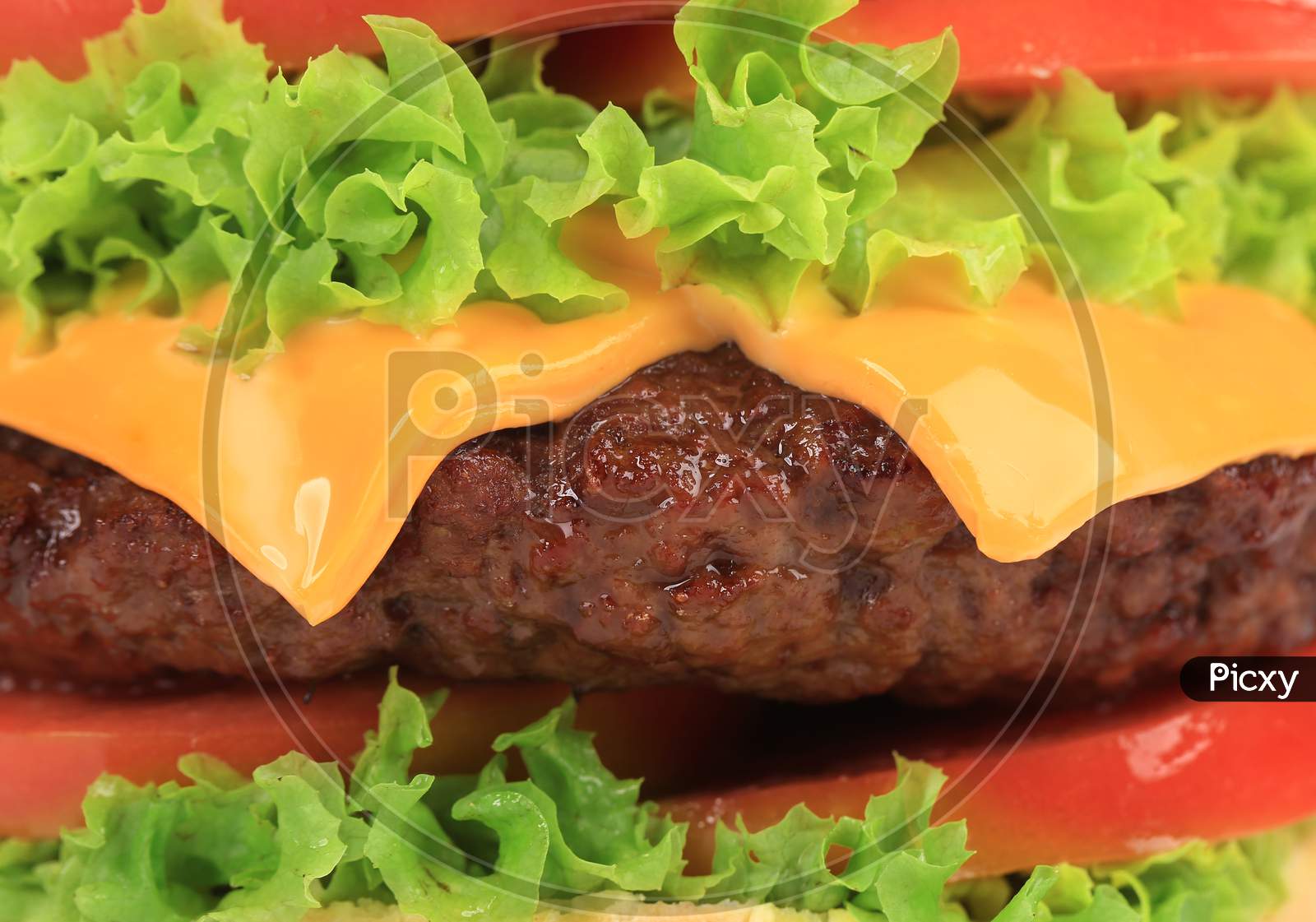 Close Up Of Big Tasty Hamburger. Whole Background.