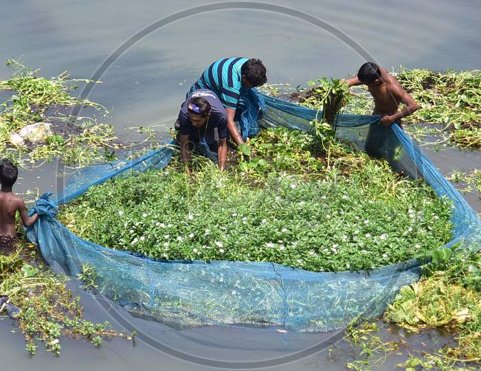 People Fising On Kolong River During Nationwide Lockdown, As A Preventive Measure Against The Covid-19 Coronavirus, In Nagaon District Of Assam On April 03,2020.