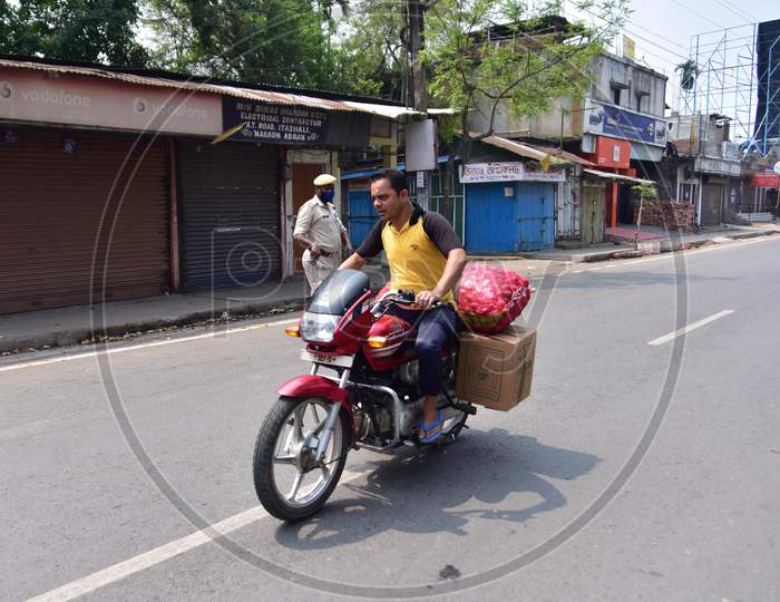 A Man Carry Essential On His Bike  After India Ordered A 21-Day Nationwide Lockdown To Limit The Spreading Of Coronavirus Disease (Covid-19)  In Nagaon District Of Assam On Mar 26,2020.