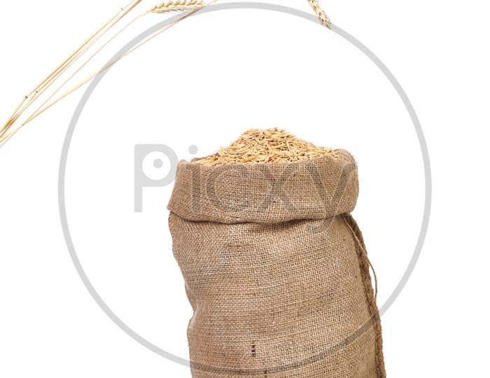 Sack With Grains And Ear Wheat. Isolated On A White Background.