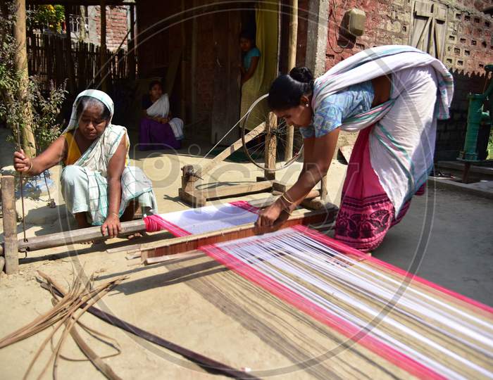 Women Busy In Weaving Traditional Assamese Gamosa Ahead Of Rongali Bihu Festival  During The Nationwide Lockdown Imposed In Wake Of Coronavirus Pandemic, In Nagaon District Of Assam On April 02,2020.