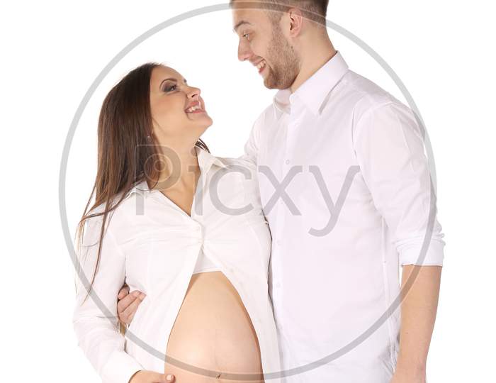 Laughing Couple Expecting Baby. Isolated On A White Background.