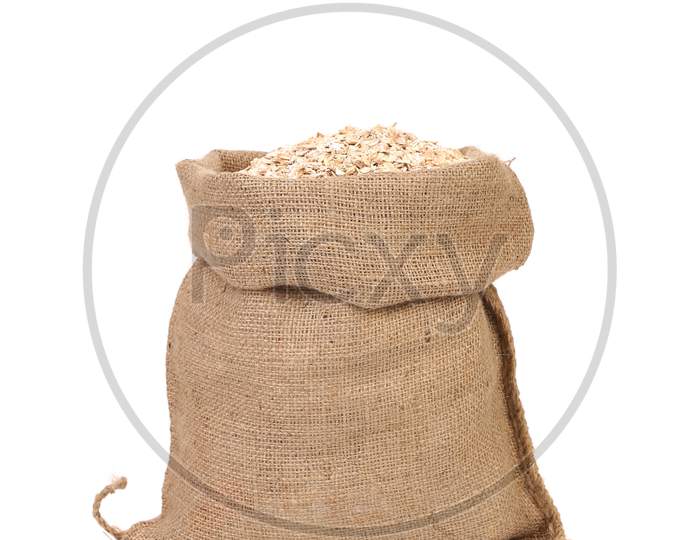 Bag Of Oatmeal Flakes. Close Up. Isolated On A White Background.