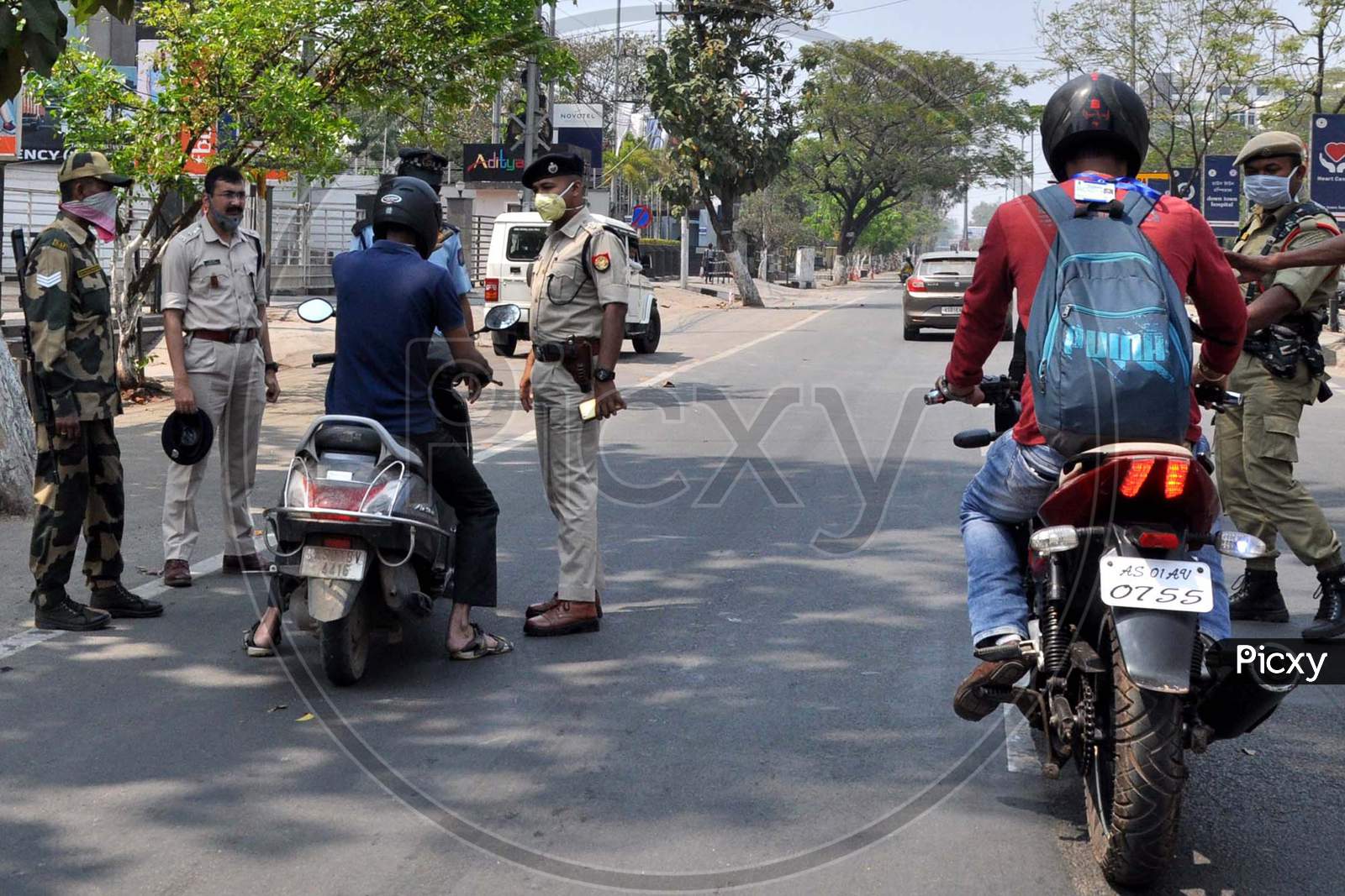 Police Personnel Question Commuters Who Defied Curfew During A 21-Day Nationwide Lockdown, In The Wake Of Coronavirus Pandemic, In Guwahati  On  Wednesday, March 25, 2020.