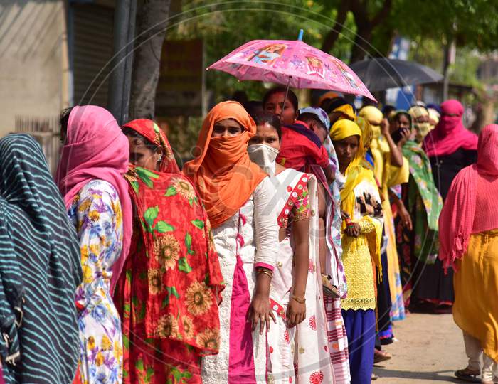 Beneficiaries Stand In A Queue Without Maintaining Social Distance In Front Of A Bank, To Receive Rs 500 Under The Pradhan Mantri Jan Dhan Yojana, During The Nationwide Lockdown Amid Coronavirus Outbreak Nagaon District Of Assam On April 06,2020.