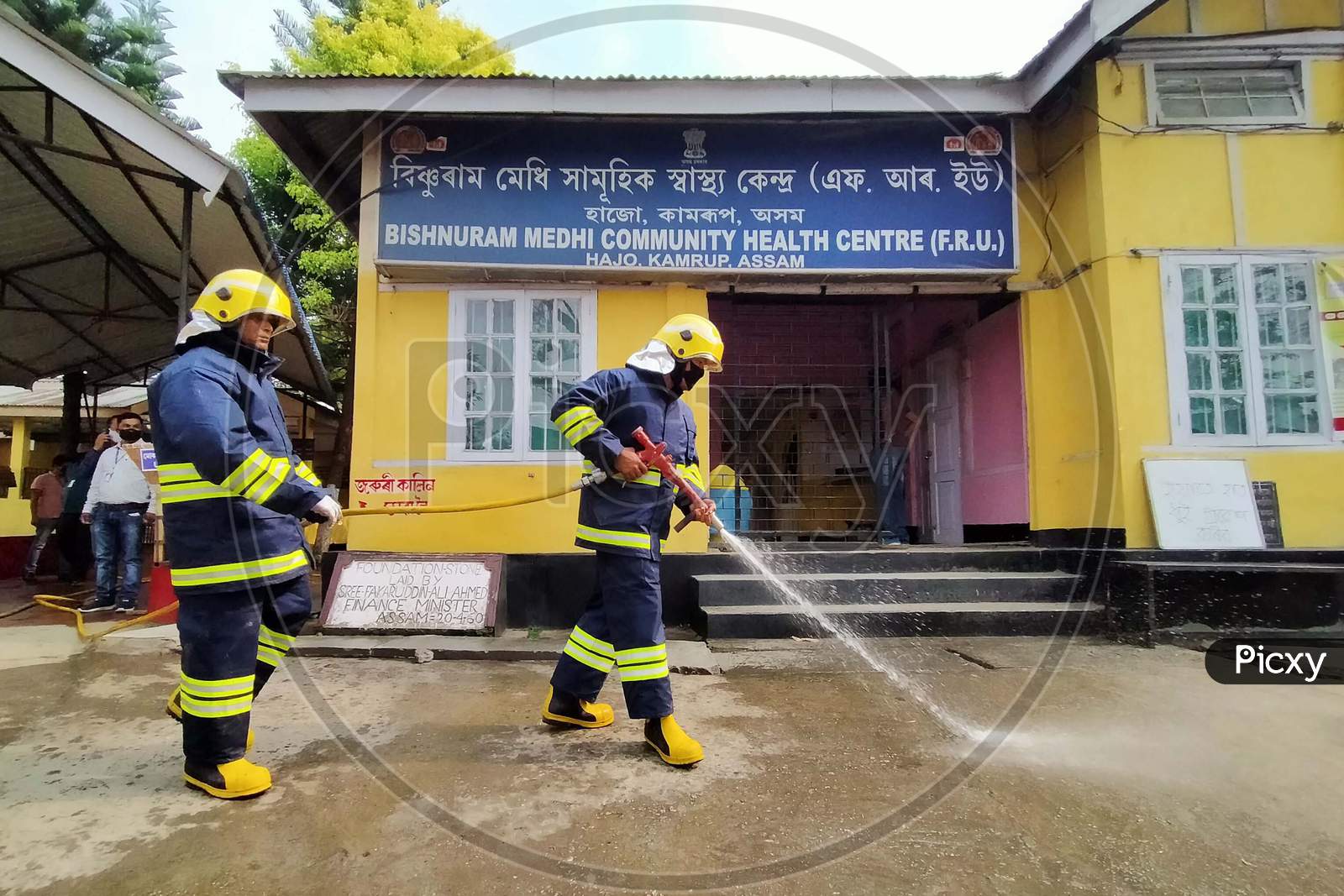 Firefighter Sprays Disinfectants As A Preventive Measure Against The Spread Of The New Coronavirus On A Community Health Centre At Hajo In Kamrup District Of Assam ,India