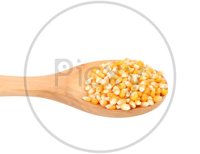Corn Grain In Wooden Spoon. Isolated On A White Background.