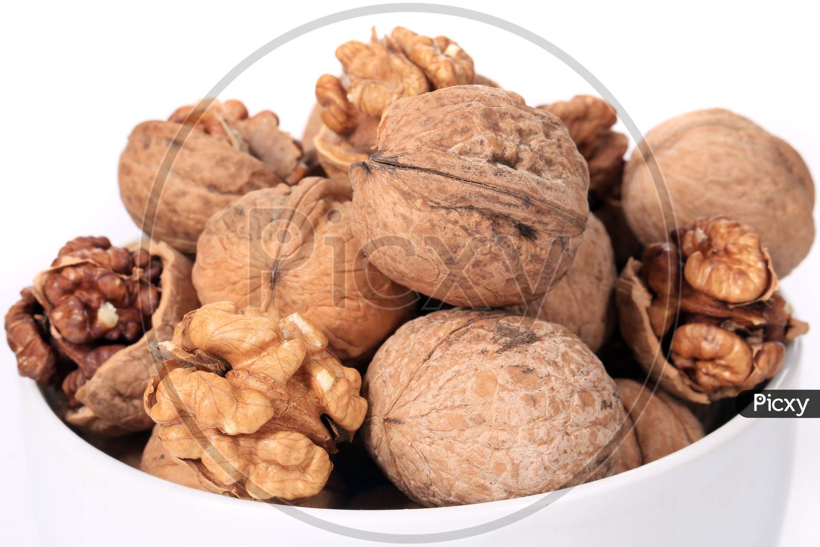 Bowl Full With Walnuts. Close Up. Whole Background.