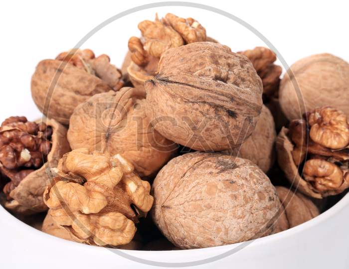 Bowl Full With Walnuts. Close Up. Whole Background.