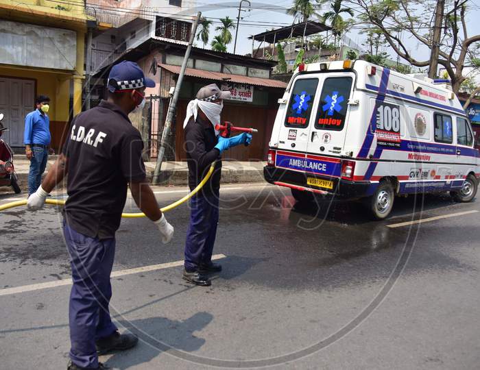 Firefighter Sprays Disinfectants As A Preventive Measure Against The Spread Of The New Coronavirus On A  Ambulence   In Nagaon District Of Assam ,India
