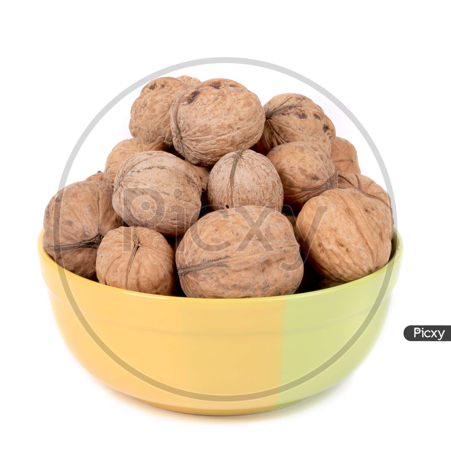 Bowl Full With Walnuts. Isolated On A White Background.