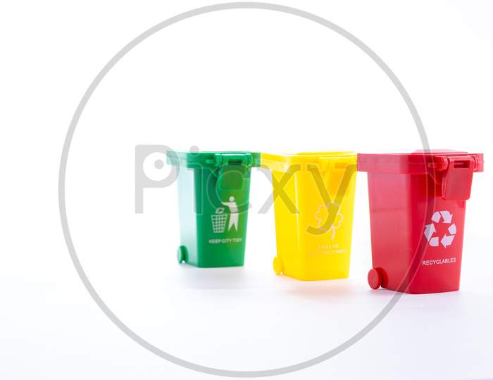 Mini Color Recycling Bins On White Background