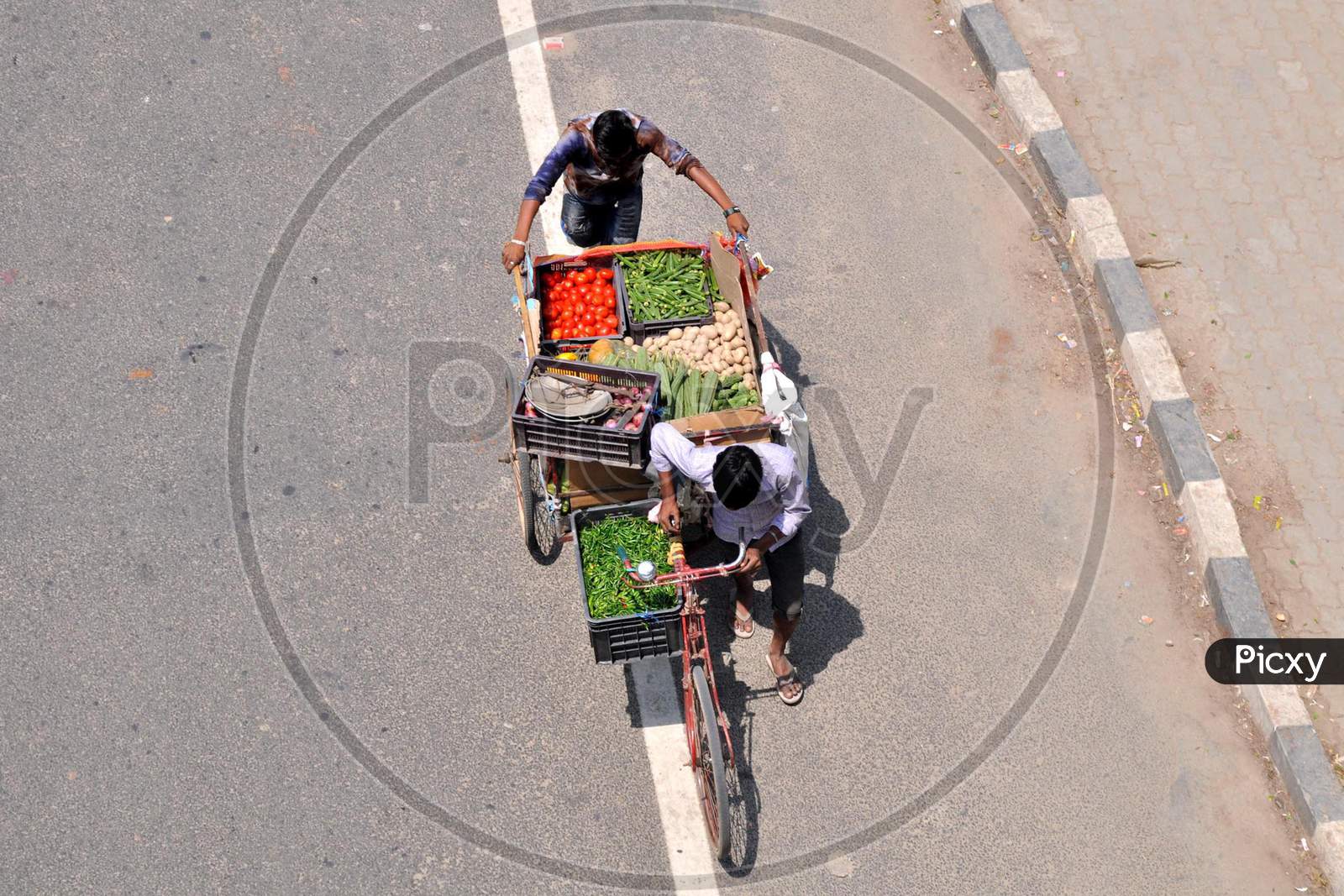Vendor Carries Vegetables For Sale  During Nationwide Lockdown, As A Preventive Measure Against The Covid-19 Coronavirus, In  Guwahati ,India