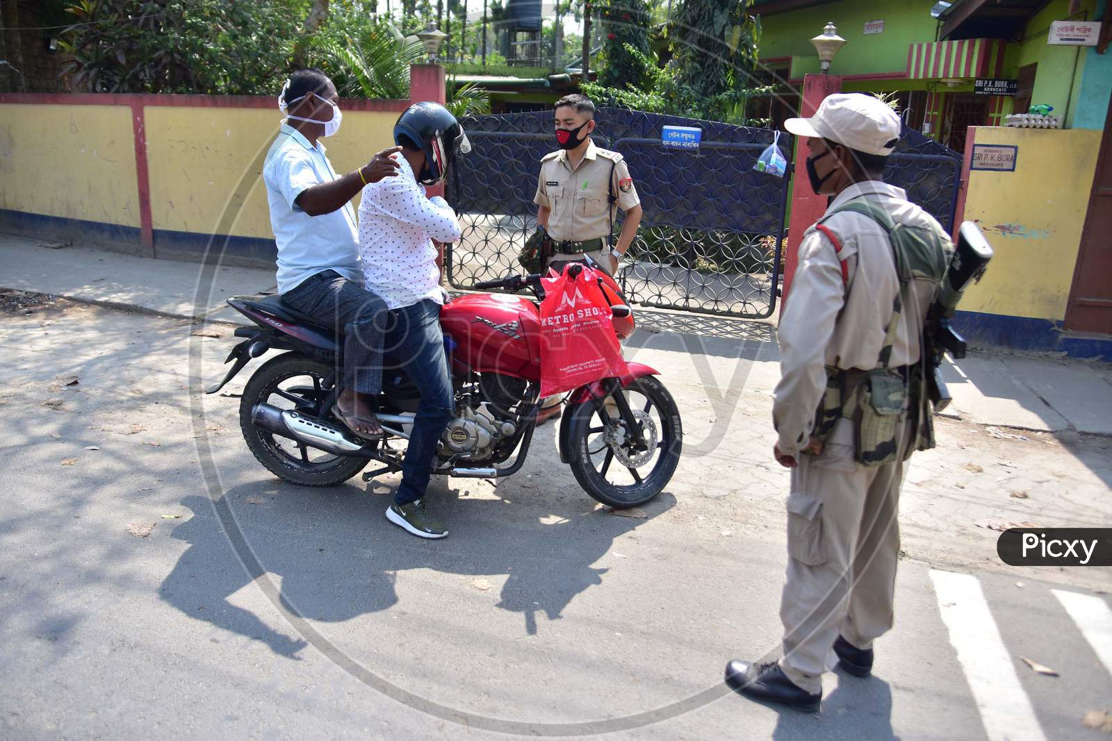 Police Personnel Question Commuters Who Defied Curfew During A 21-Day Nationwide Lockdown, In The Wake Of Coronavirus Pandemic, In Nagaon District Of Assam ,India
