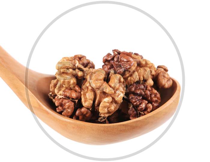 Wooden Spoon Full With Walnuts. Isolated On A White Background.