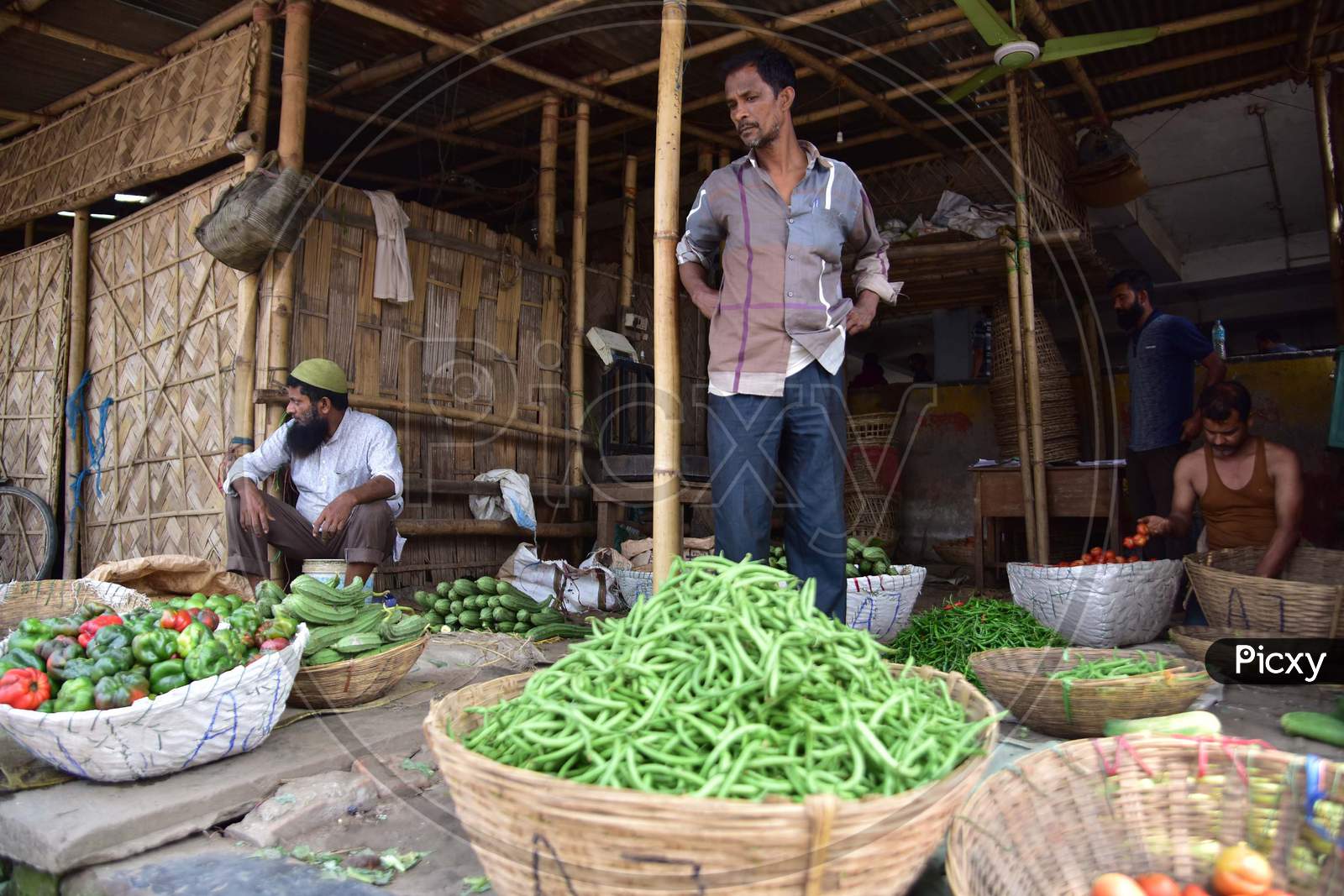 Vendors  Wait For Customer At A  Vegetables Market  On The Third  Day Of National Lockdown Imposed By Pm Narendra Modi To Curb The Spread Of Coronavirus In Nagaon District Of Assam ,India