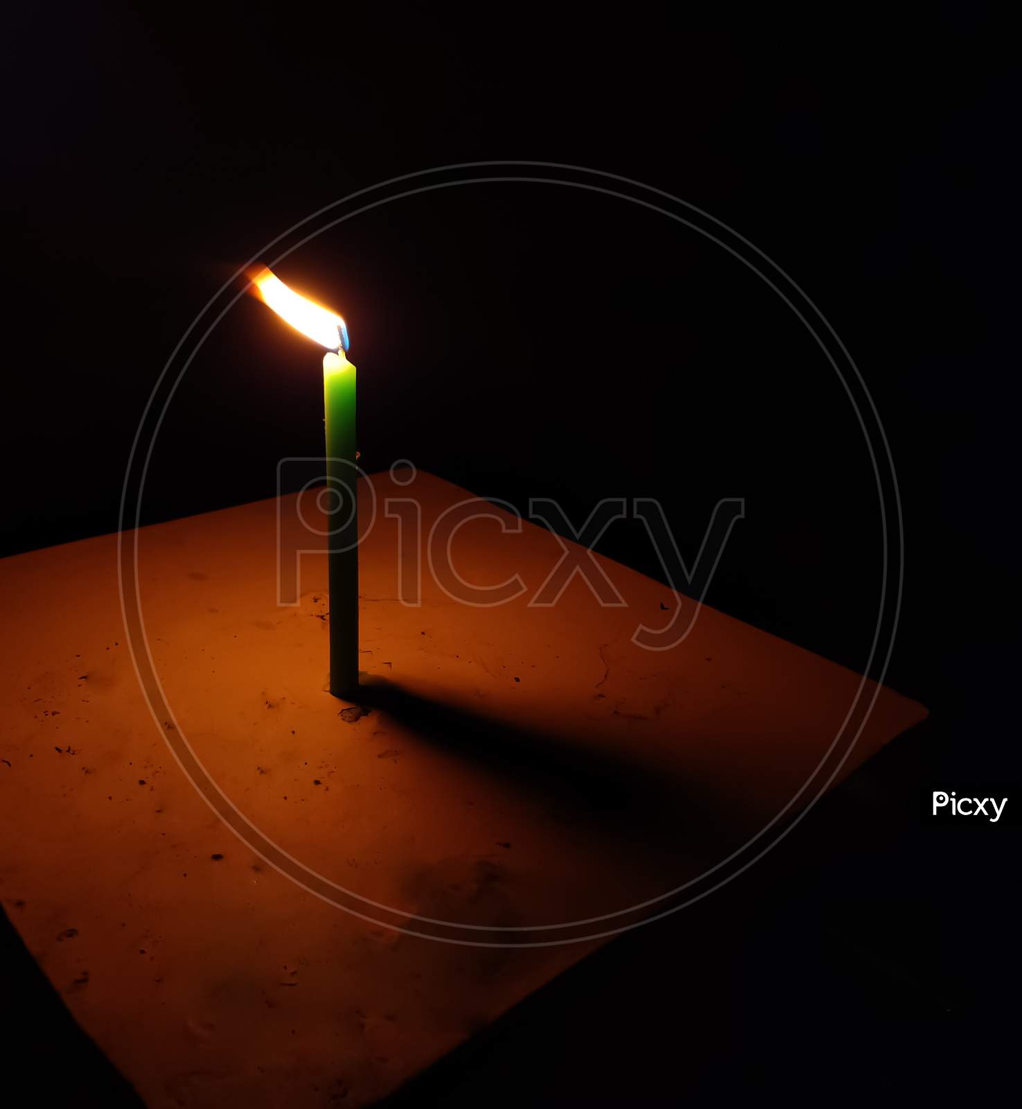 Light candle dark background