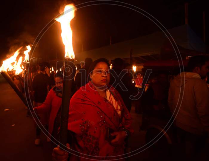 Activists of All Assam Students Union (AASU) along with 30 Ethnic Organisation taking out a torch light rally protest against Citizenship Amendment Act (CAA) in Assam