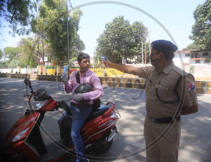 Police Checking The Commuters With Thermal Sensor Apparatus  For Corona Virus Or COVID 19 in Prayagraj