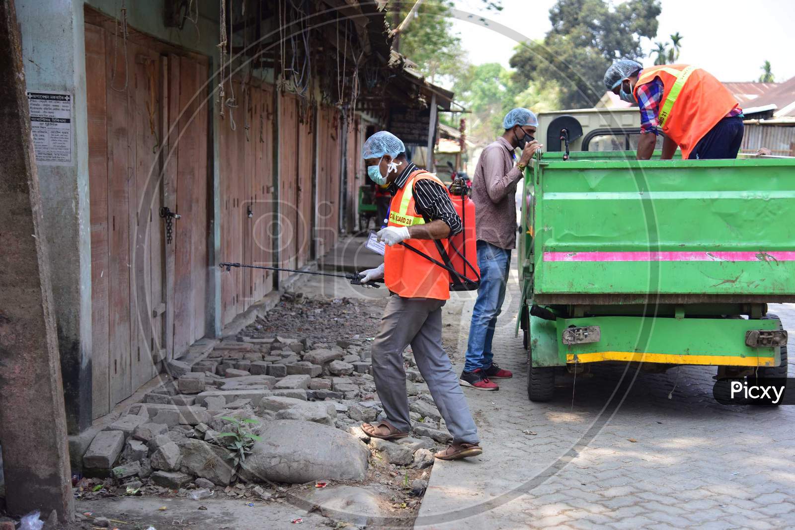 A Municipality Worker Spray Disinfectant During India Government-Imposed Lockdown As A Preventive Measure Against The Covid-19 Coronavirus In Nagaon District Of Assam ,India