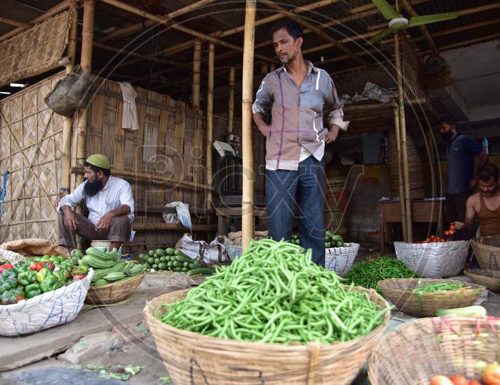 Vendors  Wait For Customer At A  Vegetables Market  On The Third  Day Of National Lockdown Imposed By Pm Narendra Modi To Curb The Spread Of Coronavirus In Nagaon District Of Assam ,India