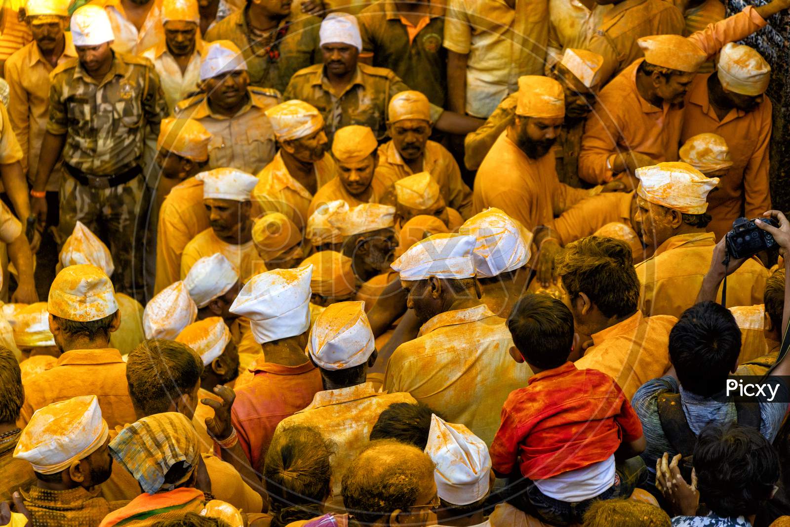People Throwing Turmeric At Jejuri Temple- Yellow Festival