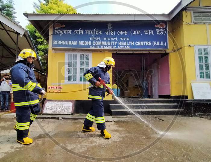 Firefighter Sprays Disinfectants As A Preventive Measure Against The Spread Of The New Coronavirus On A Community Health Centre At Hajo In Kamrup District Of Assam ,India