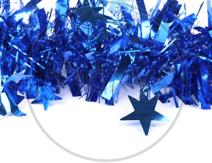 Christmas Blue Tinsel With Stars. There Is White Space For Text