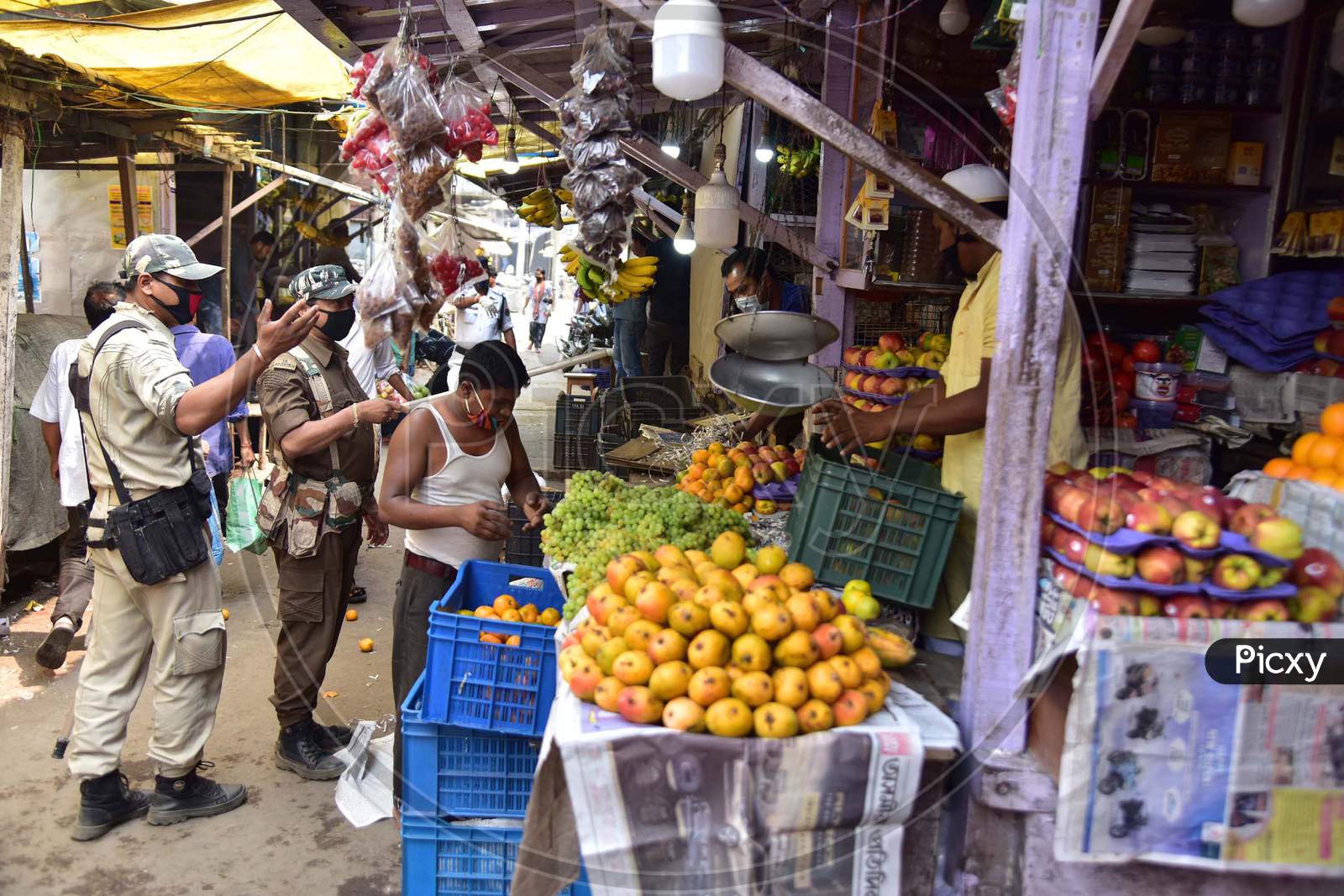 Police Personnel Patrol Through Barbazar Market Asking Vendors To Shut Their Stalls During The Third  Day Of National Lockdown Imposed By Pm Narendra Modi To Curb The Spread Of Coronavirus In Nagaon District Of Assam ,India