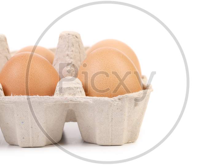 Brown Eggs In Egg Box. Whole Background. Place For Text.