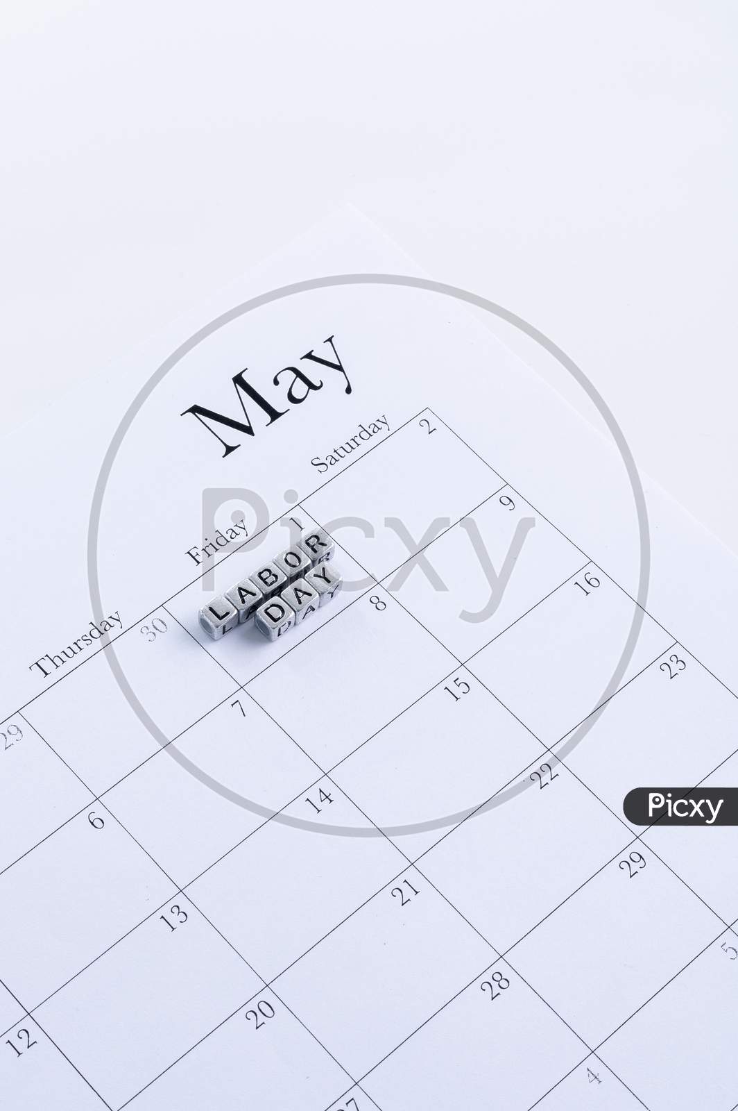 Concept Image Of A Calendar With A Silver Cube Word. Closeup Shot. The Words "Labor Day" On Isolated, Copy Space