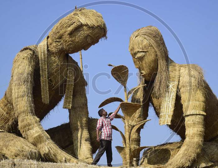 A worker prepares a makeshift cottage called Bhelaghar, which is made of bamboo and straw, as part of celebrations ahead of the Magh Bihu festival in Morigaon