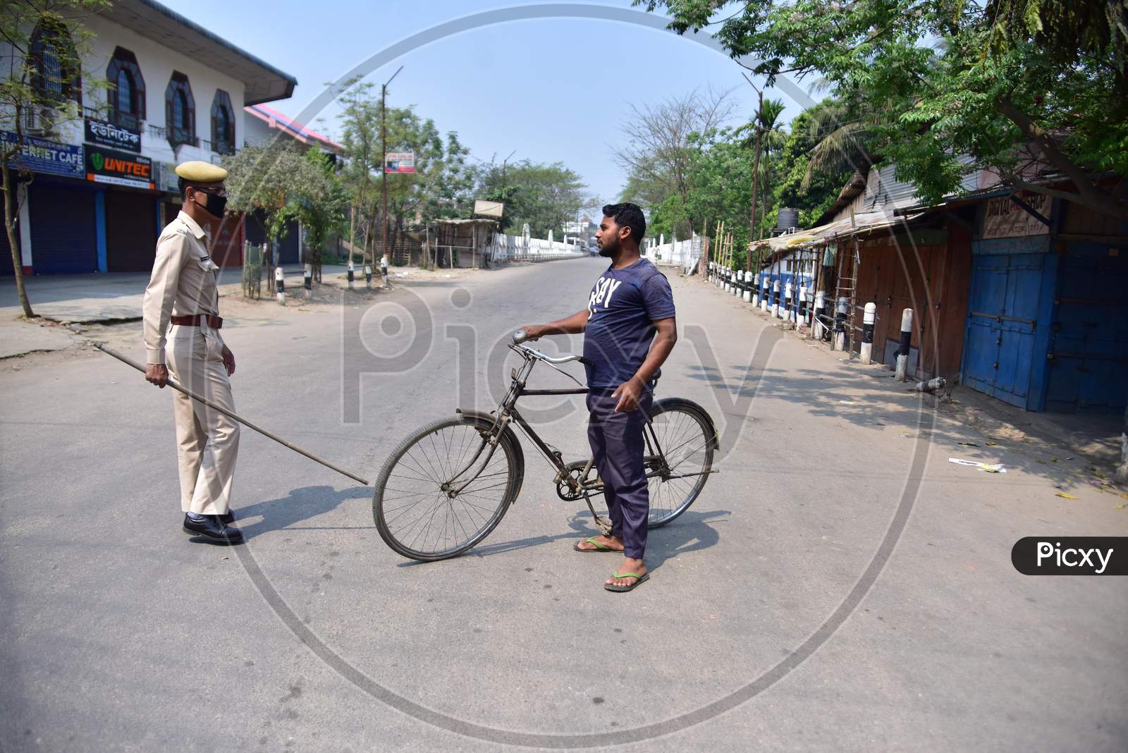 Police Personnel Question Commuters Who Defied Curfew During A 21-Day Nationwide Lockdown, In The Wake Of Coronavirus Pandemic, In Nagaon District Of Assam,India