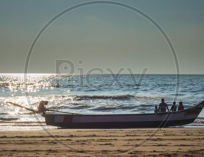 Family Members Spending Their Peaceful Time On Morning Sunrise Seascape. Family Siting On Boat