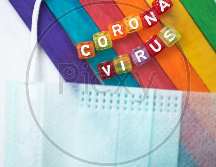 Colorful Word Corona Virus English Alphabet Cube On Colourfull Background Face Mask, Selective Focus