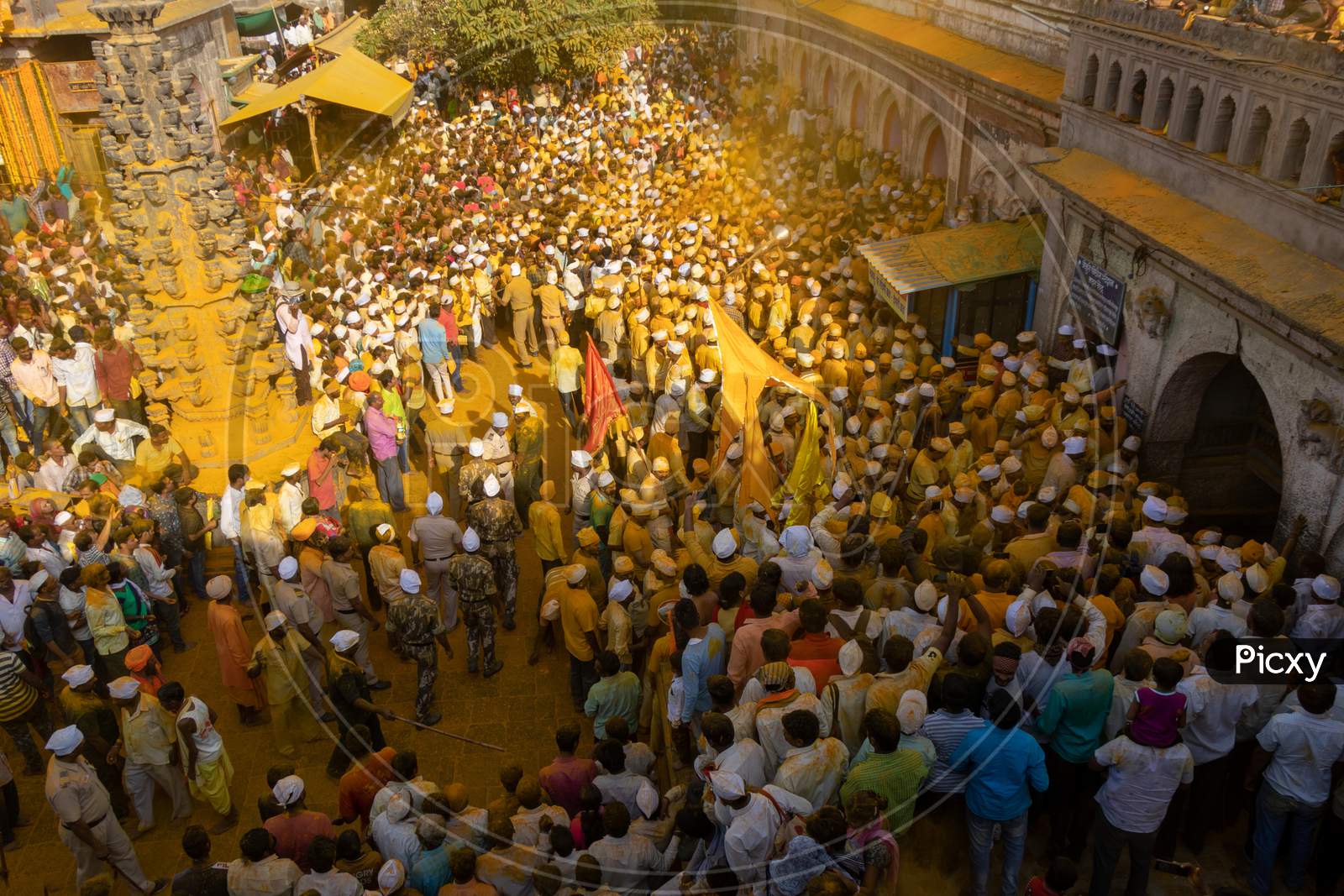 People Throwing Turmeric At Jejuri Temple - Yellow Festival.