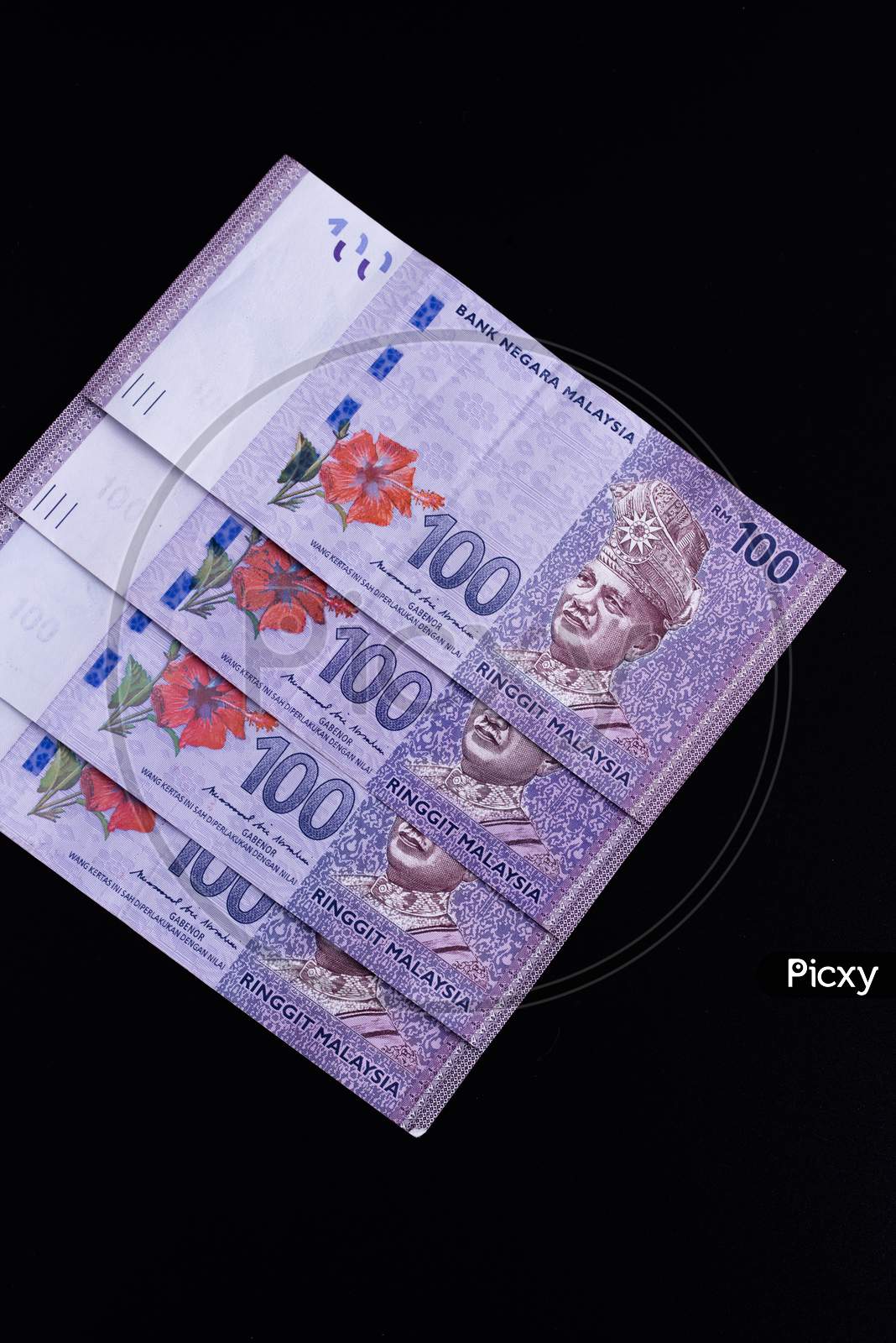 Malaysia Currency Of Malaysian Ringgit Banknotes Background. Paper Money Of Hundred Ringgit Notes On Etreme Closeup. Financial Concept.